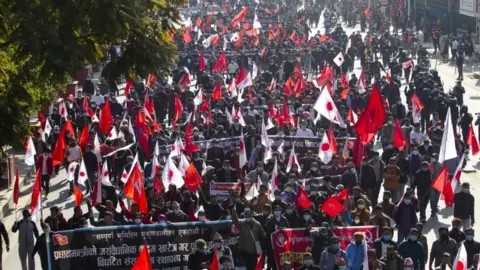 Members of Nepal's political party protest against PM's absence
